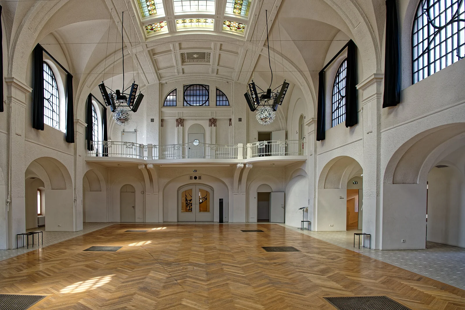 The restored vaulted hall and wooden floor within Musée Unterlinden
