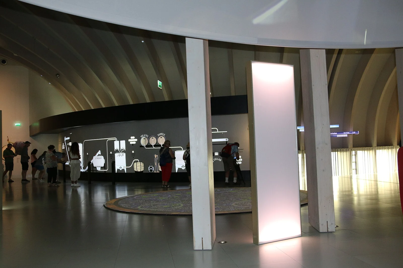Visitors exploring the wine-making exhibits at La Cité du Vin