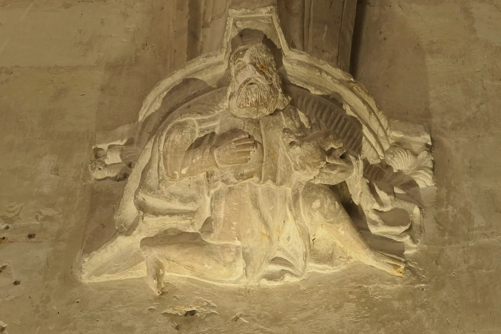 A carved figure and stone detail in Fontevraud Abbey’s refectory
