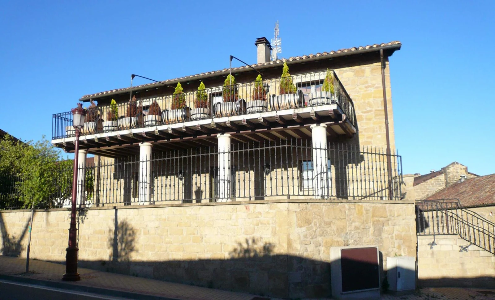 Stone winery building and balcony at Bodegas Muga in Haro
